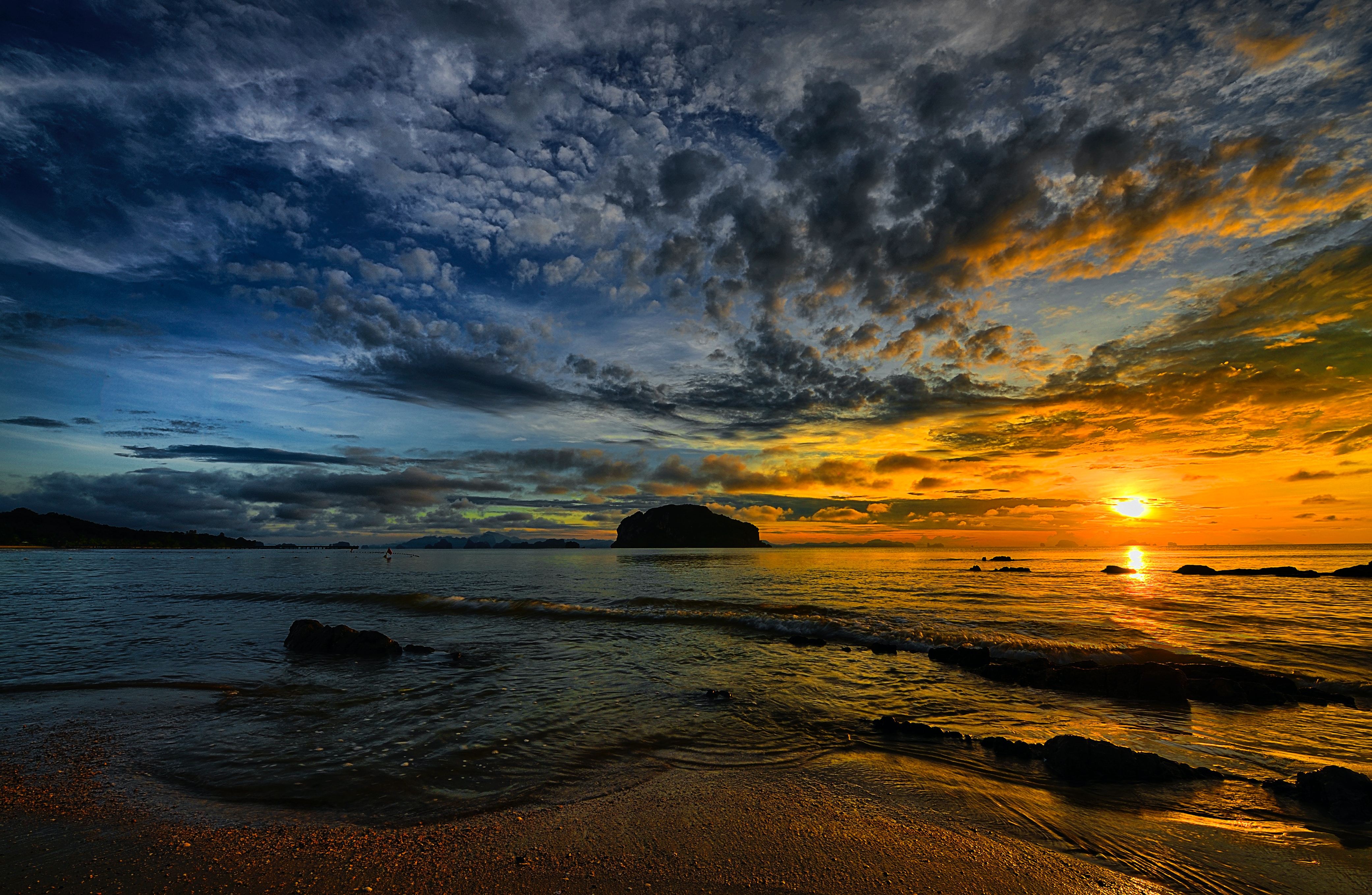 sunset over the ocean in Thailand with a colorful cotton candy sky